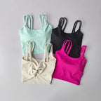 Set of four stylish push up sports bras for women in mint, black, beige, and pink colors