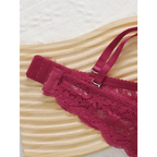 Close-up of part of a burgundy lace push up underwire bra and panty set with adjustable straps