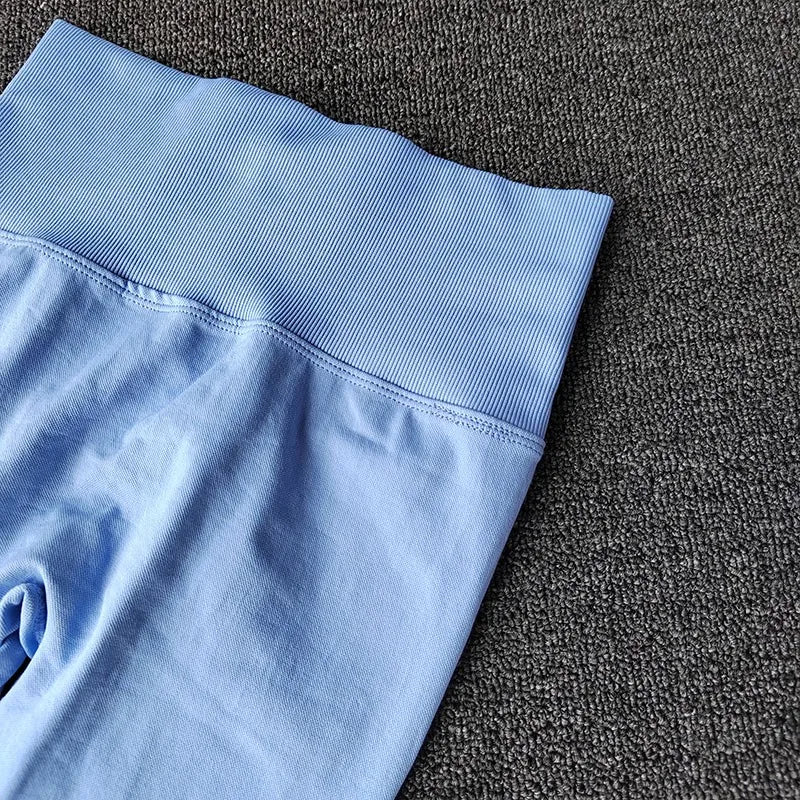Light blue quick dry sport leggings with a wide waistband for comfortable activewear