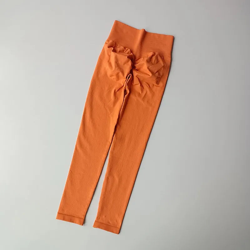 Orange quick dry sport leggings from The Lady's Haven Boutique, designed for comfort and performance