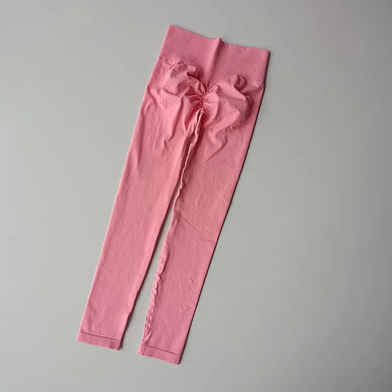 Pink quick dry sport leggings with a stylish bow detail for active women
