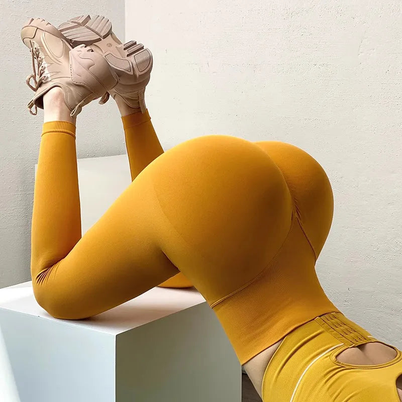 Stylish quick dry sport leggings in mustard yellow, perfect for workouts and active lifestyles