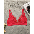 Red lace push up bra for women with adjustable straps and hook closure on a gray fur background