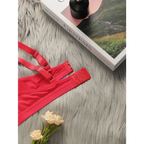 Red lace push up bra for women with adjustable straps and hook closure on gray fur background