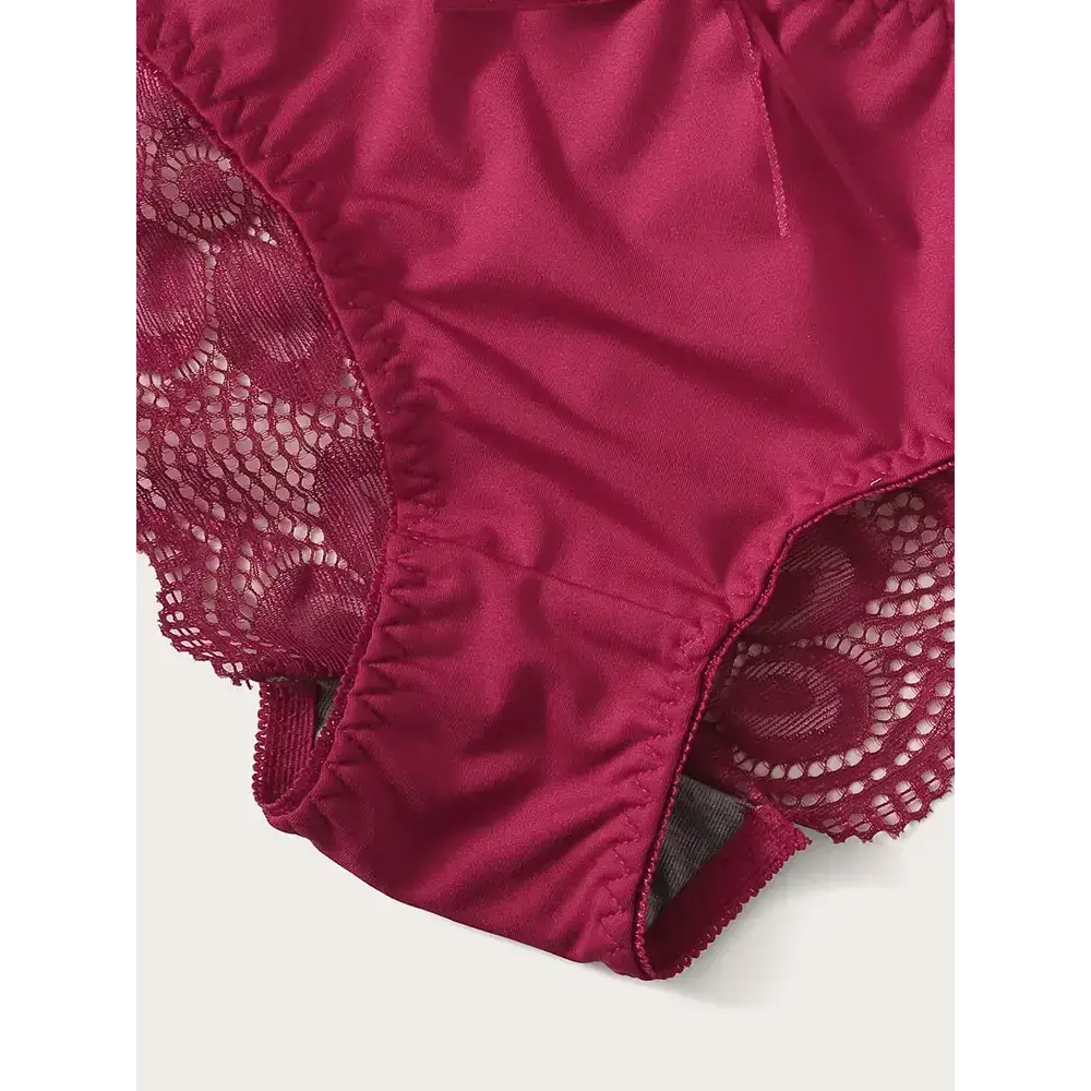 Close-up of burgundy two piece lace lingerie outfit with floral lace and smooth fabric detailing