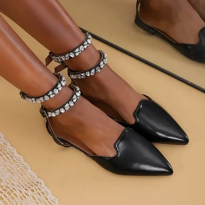 Black flat heel rhinestone ankle strap sandals with pointed toes from The Lady's Haven Boutique