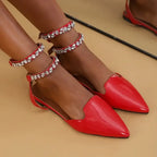 Red flat heel rhinestone ankle strap sandals from The Lady's Haven Boutique on model feet