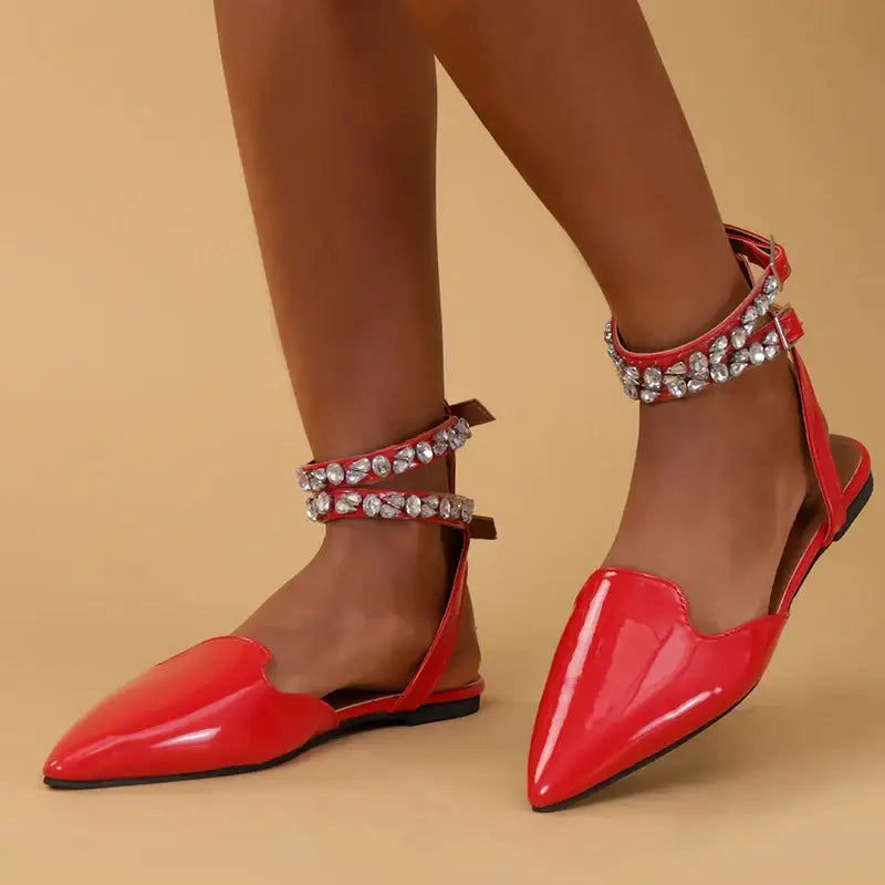 Red flat heel rhinestone ankle strap sandals from The Lady's Haven Boutique with pointed toes