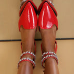 Red flat heel rhinestone ankle strap sandals with pointed toe from The Lady's Haven Boutique