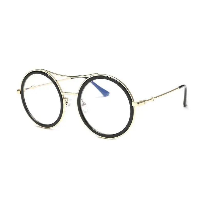 Chic round sunglasses with designer flair from The Lady's Haven Boutique featuring bold black frames