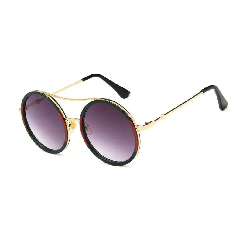 Stylish round sunglasses with designer flair featuring gold accents and gradient lenses