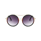 Chic round sunglasses with designer flair featuring gradient lenses and stylish frame at The Lady's Haven Boutique