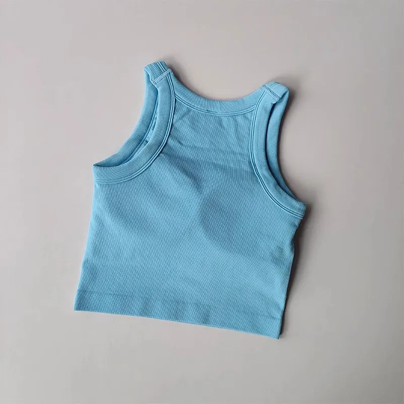 Light blue seamless sports vest for women in a stylish ribbed design, perfect for workouts