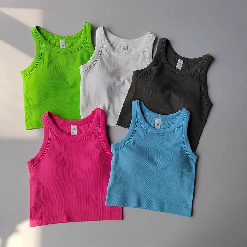 Colorful seamless sports vest for women in five shades including pink, green, blue, black, and white