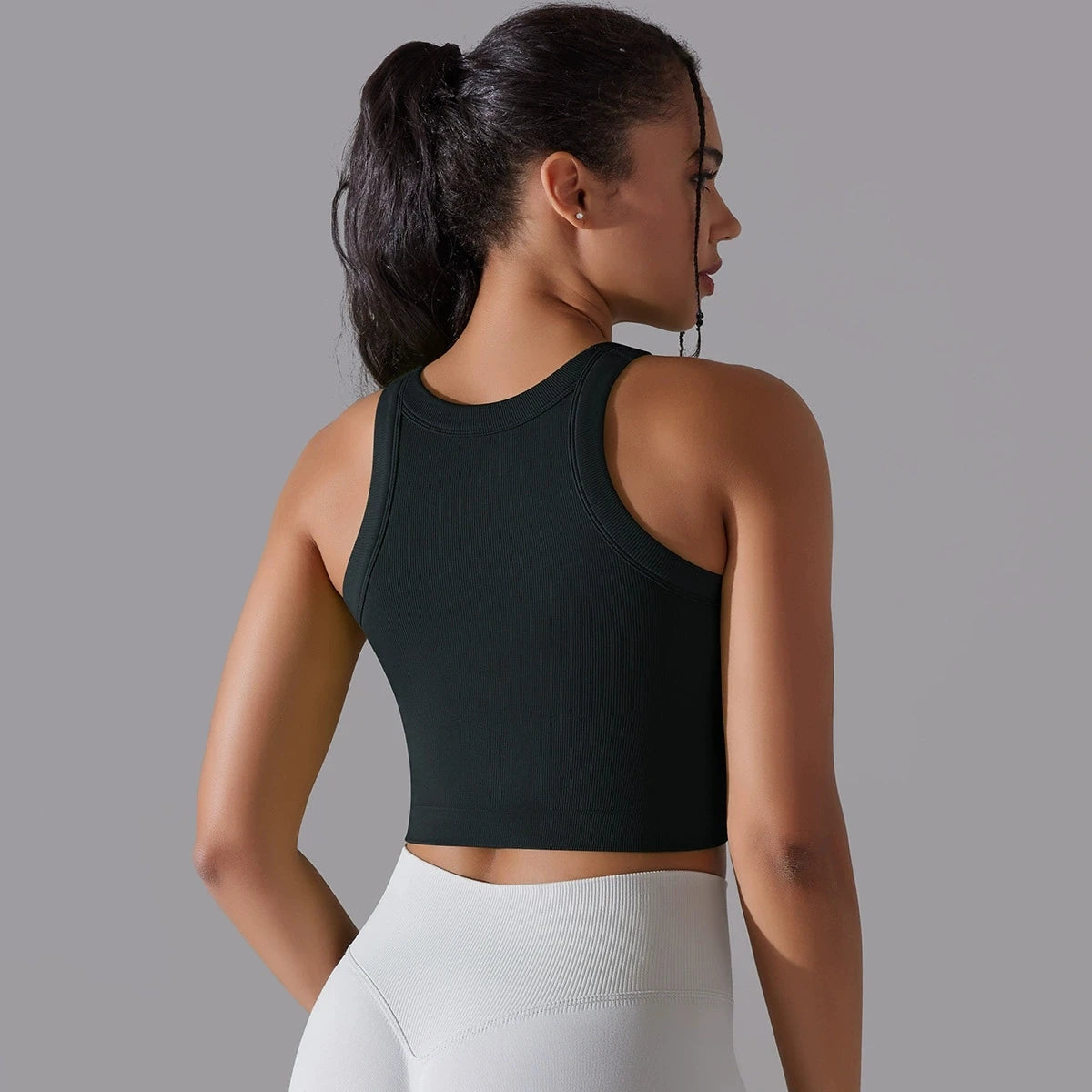 Back view of a black seamless sports vest for women, perfect for workouts and activewear
