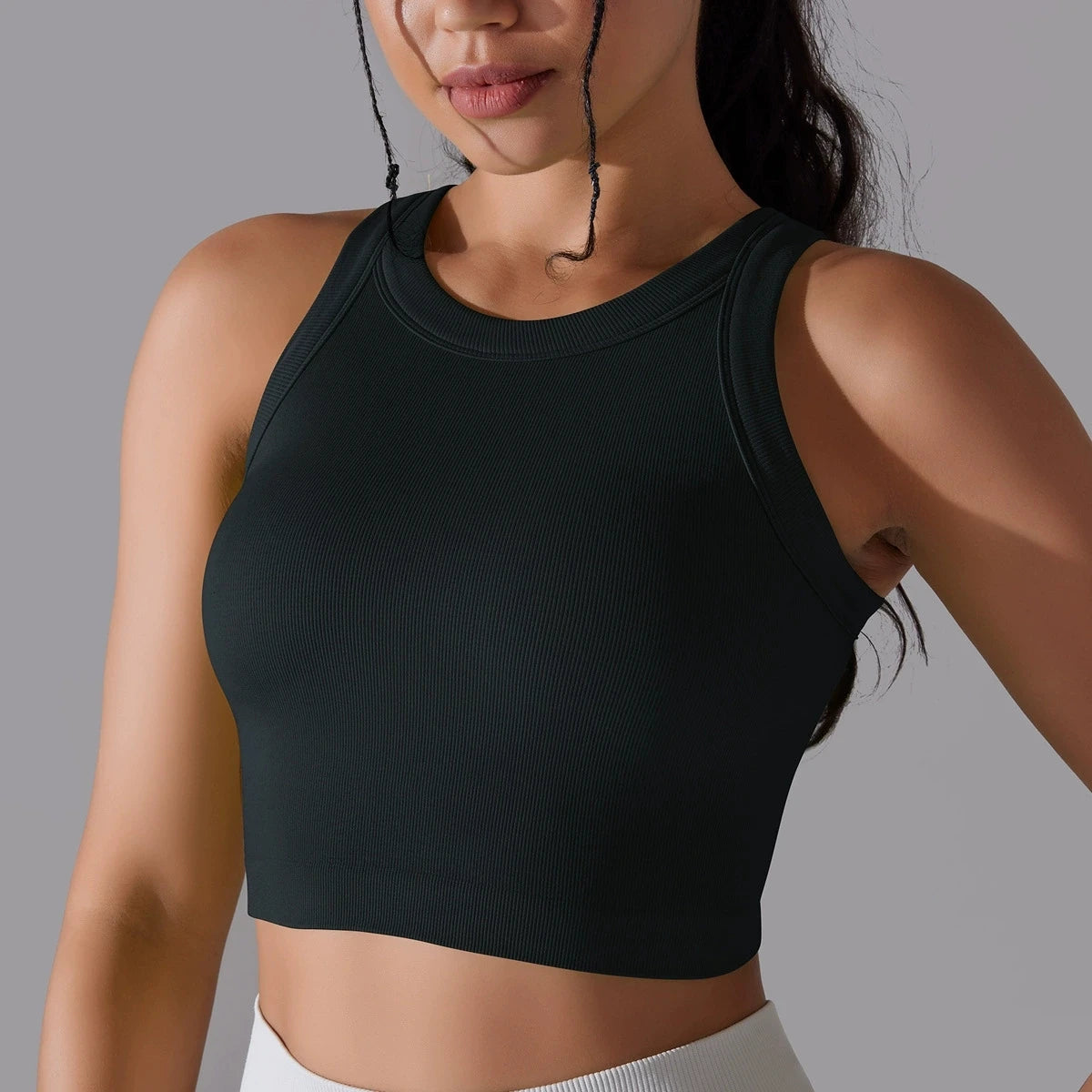 Black seamless sports vest for women, perfect for workouts and everyday wear