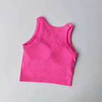 Pink seamless sports vest for women with a comfortable fit, perfect for workouts and active wear