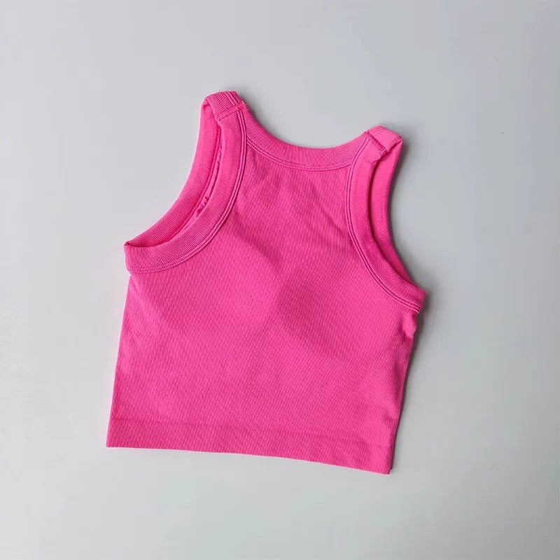 Pink seamless sports vest for women with a comfortable fit, perfect for workouts and active wear