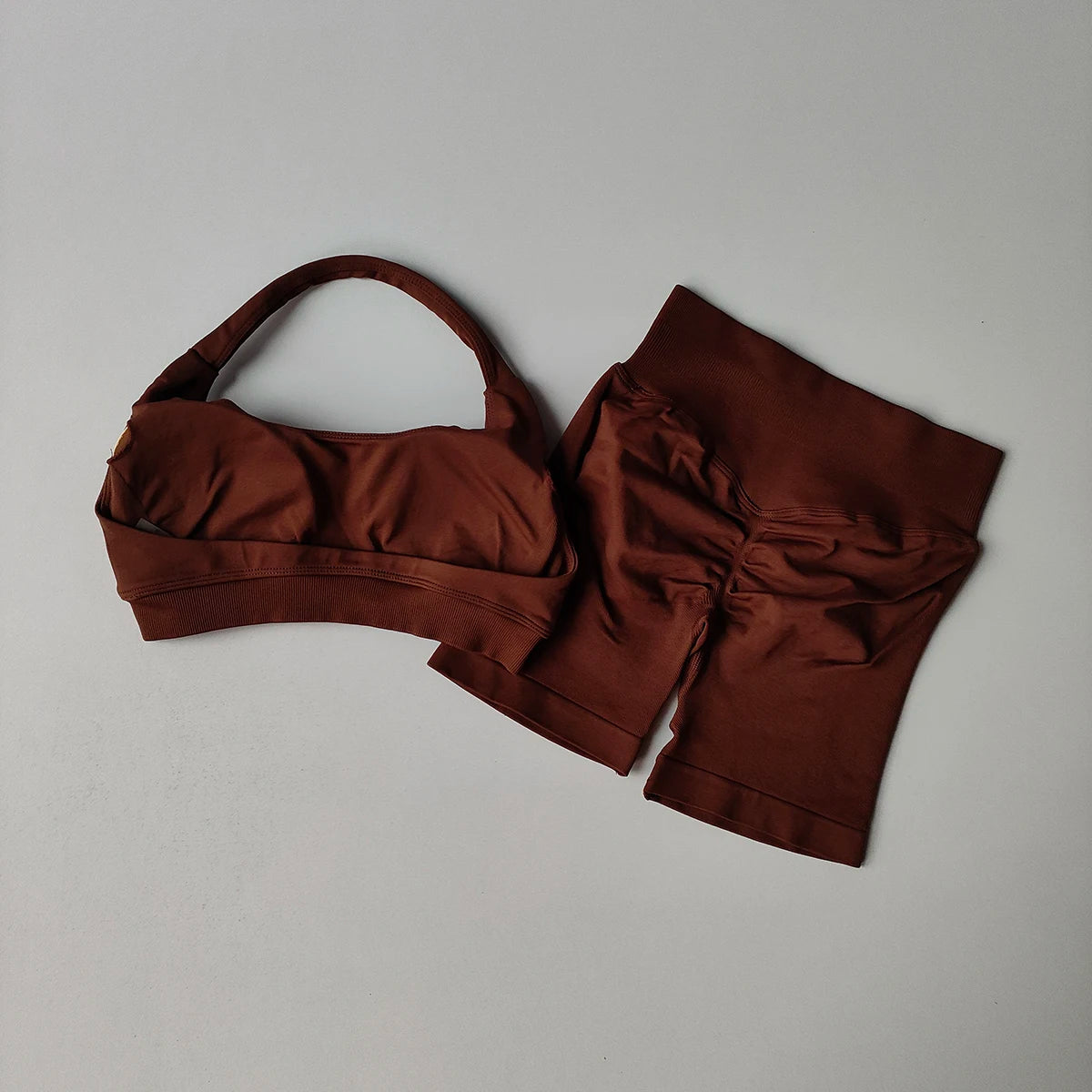 Seamless yoga suit for women in brown featuring a supportive bra and matching shorts