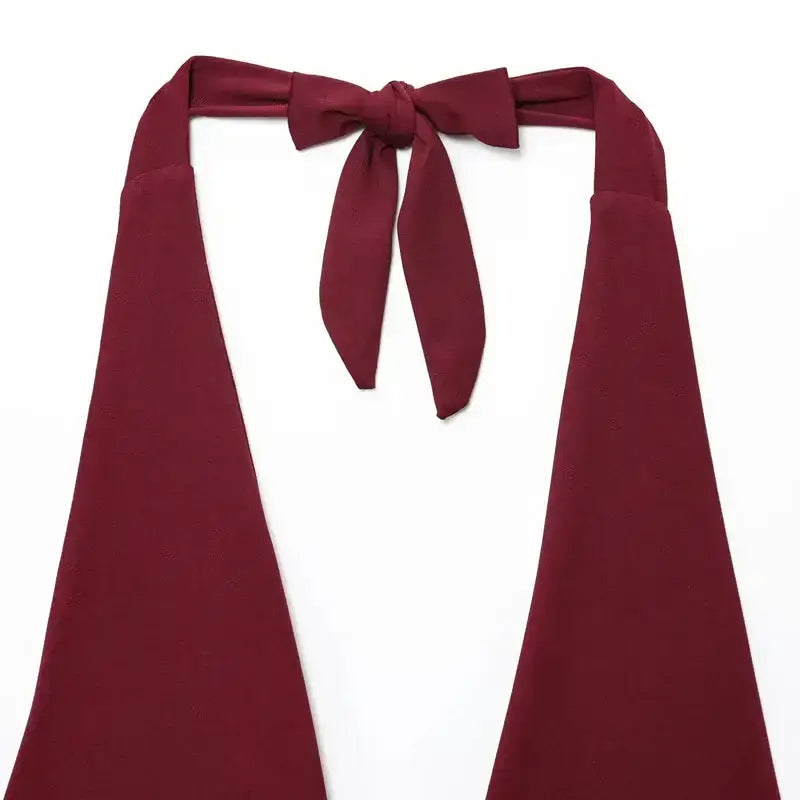 Burgundy pleated off shoulder crop top with a bow tie detail from The Lady's Haven Boutique