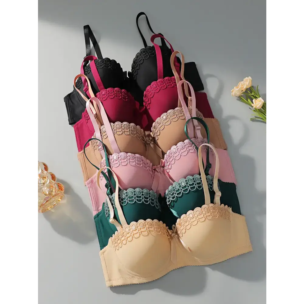Sexy embroidered flower bra collection in black red beige pink green and cream colors neatly arranged