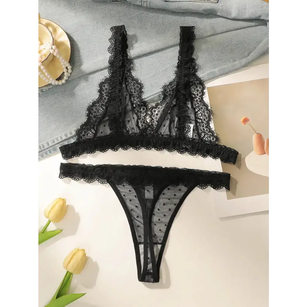Sexy embroidered lace lingerie set in black with intricate floral patterns and delicate mesh detailing