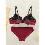 Sexy embroidered lace lingerie set in burgundy with black straps featuring lace details and matching bottoms