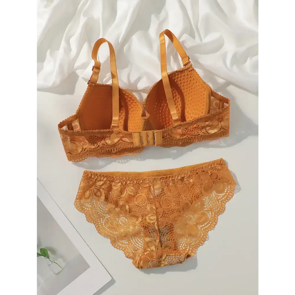 Orange sexy lace bra and panty set with floral lace design and adjustable straps