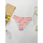 Pink panty from sexy underwire bra and panty set displayed on white surface with decorative flowers and pearl accessories