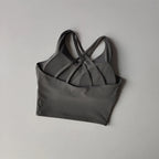 Gray shockproof crop top for women with stylish crisscross back design for active wear