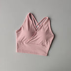 Pink shockproof crop top for women with crisscross straps and a comfortable fit