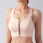 Light pink shockproof padded gym bra for women with front zipper and stylish design