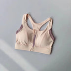 Elegant shockproof padded gym bra for women with a stylish zip front and breathable fabric