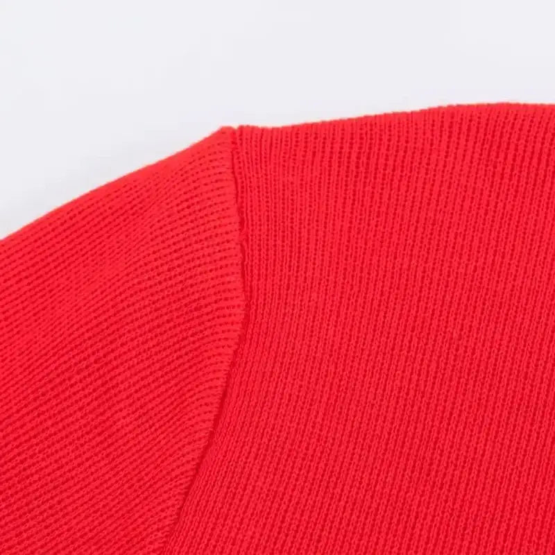 Close-up of red knit fabric detail on casual fashion cropped jacket by The Lady's Haven Boutique
