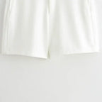 White shorts detail from summer office vest and shorts outfit by The Lady's Haven Boutique