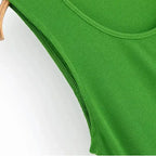 Close-up of sleeveless green maxi dress fabric texture and stitching detail
