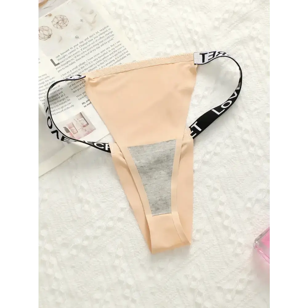 The Lady's Haven Boutique small chest lifting underwear in beige with black adjustable straps on white background