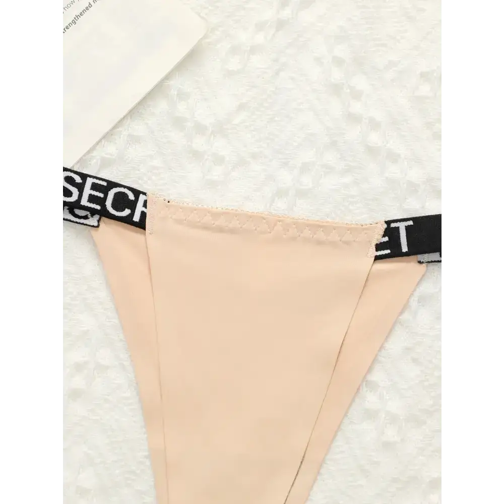 Beige small chest lifting underwear with black elastic waistband from The Lady's Haven Boutique