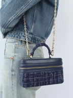 The Lady's Haven Boutique small square bag in navy blue with gold chain strap and textured fabric detail