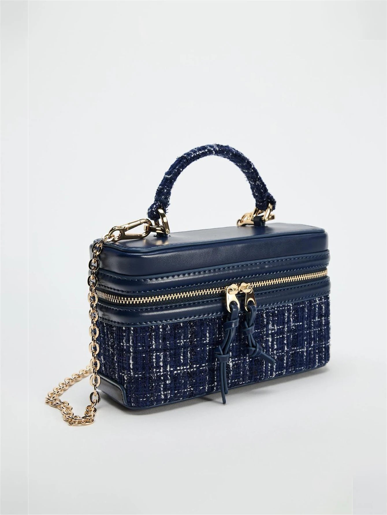 The Lady's Haven Boutique small square bag in navy blue with gold chain and textured fabric details