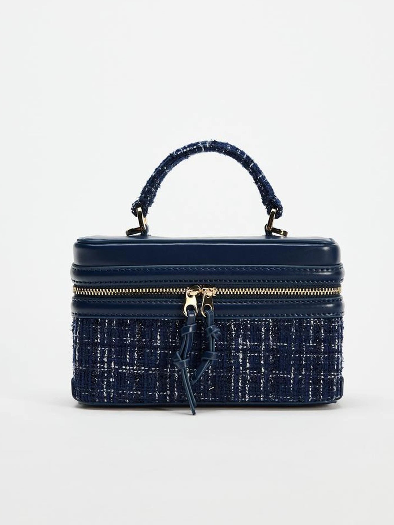 The Lady's Haven Boutique small square bag in navy blue with textured fabric and top handle