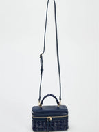 The Lady's Haven Boutique small square bag in navy blue with adjustable strap and textured fabric