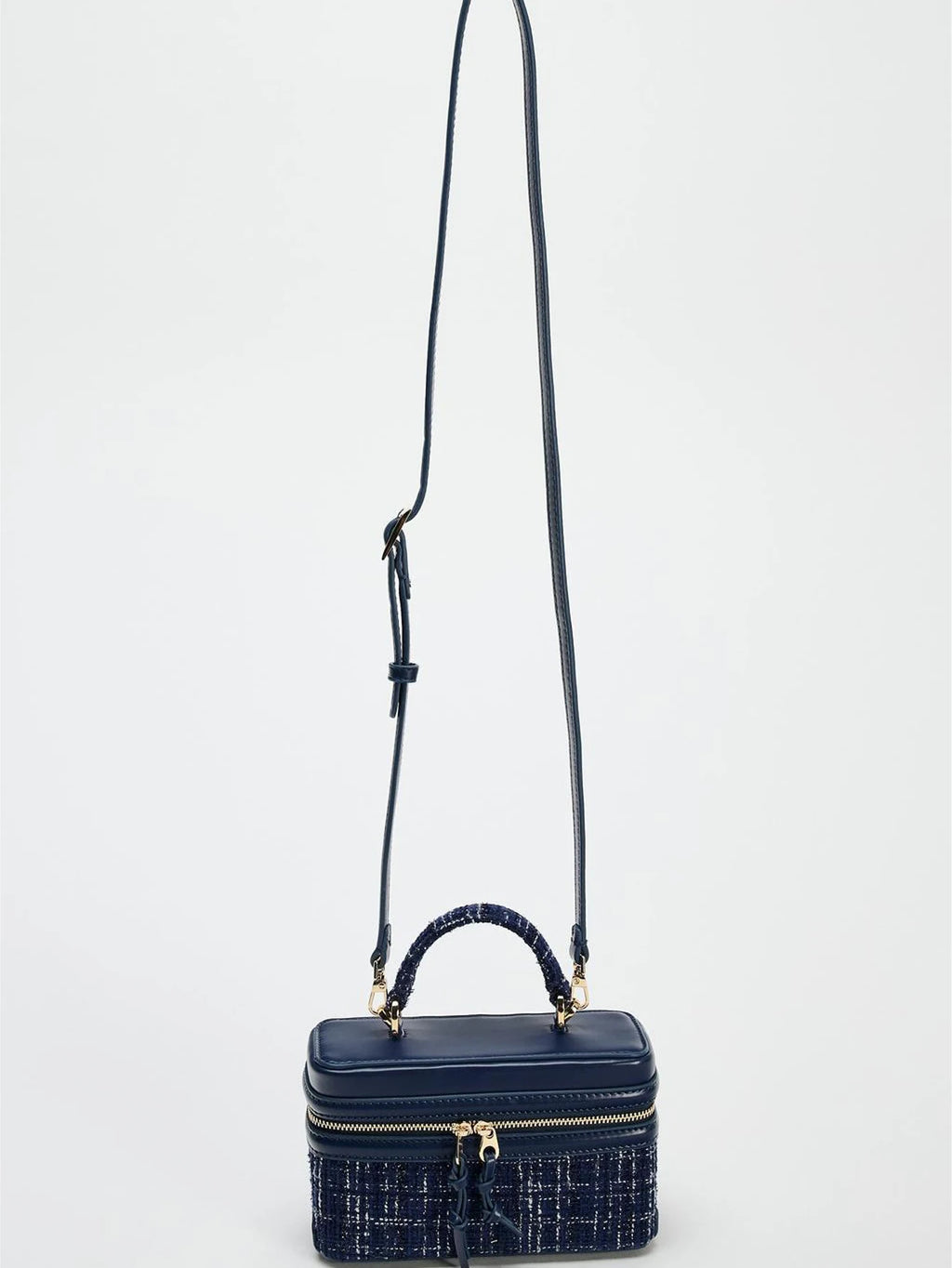 The Lady's Haven Boutique small square bag in navy with top handle and adjustable shoulder strap