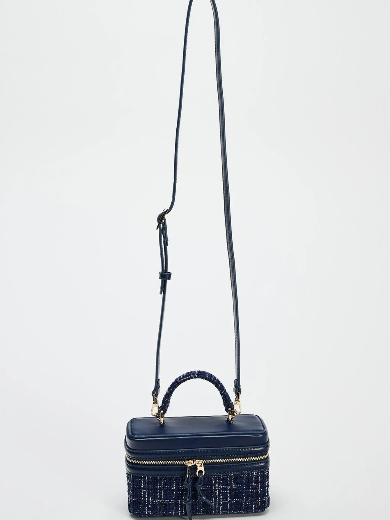 The Lady's Haven Boutique small square bag in navy with top handle and adjustable shoulder strap