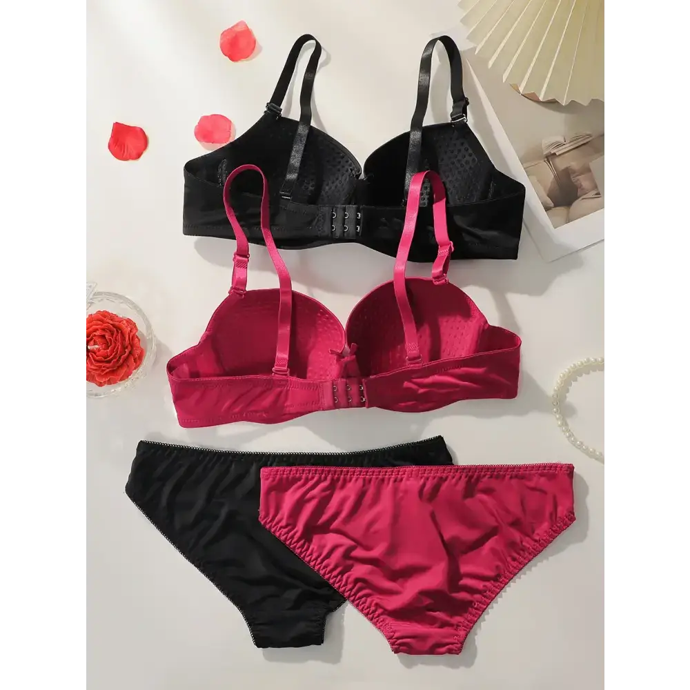 Solid color bra and panty set in black and red with adjustable straps from The Lady's Haven Boutique