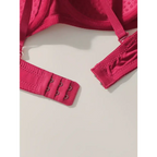Close-up of vibrant red solid color bra and panty set showing adjustable hook and eye closure
