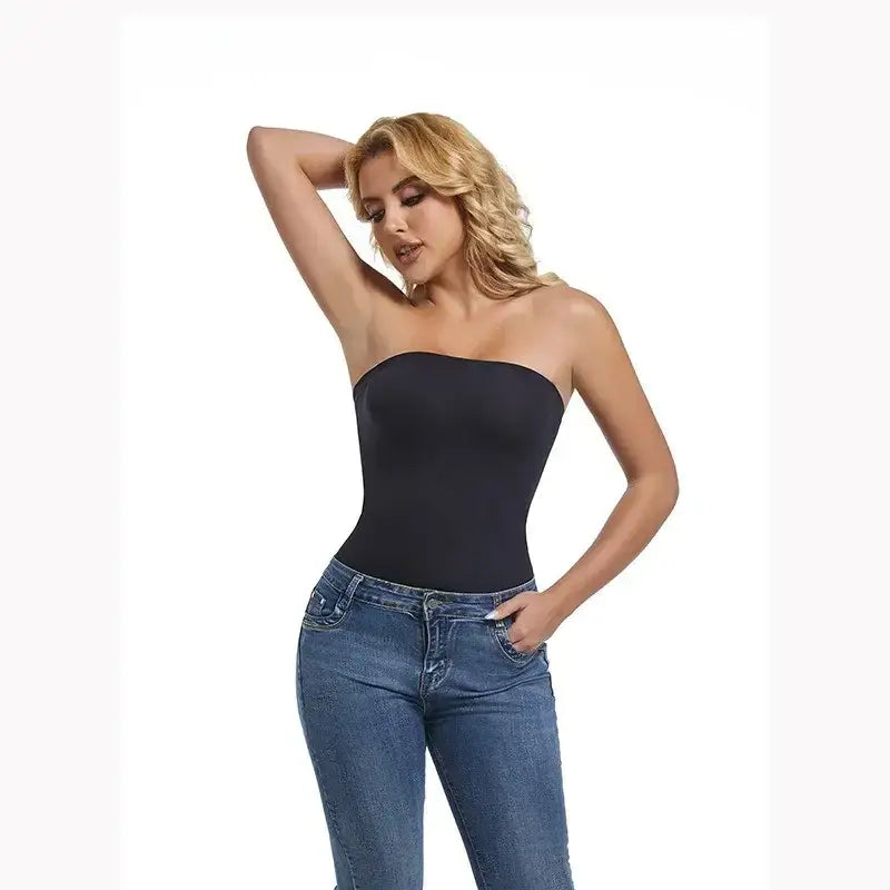 Woman wearing black strapless shapewear bodysuit paired with blue jeans from The Lady's Haven Boutique
