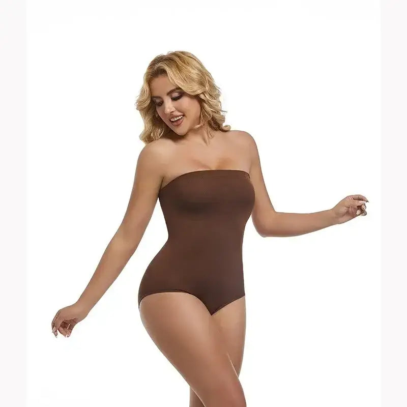 The Lady's Haven Boutique brown strapless shapewear bodysuit on smiling model with arms raised