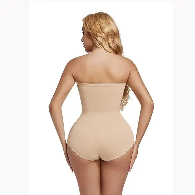 Beige strapless shapewear bodysuit smoothing waist and hips from back view by The Lady's Haven Boutique