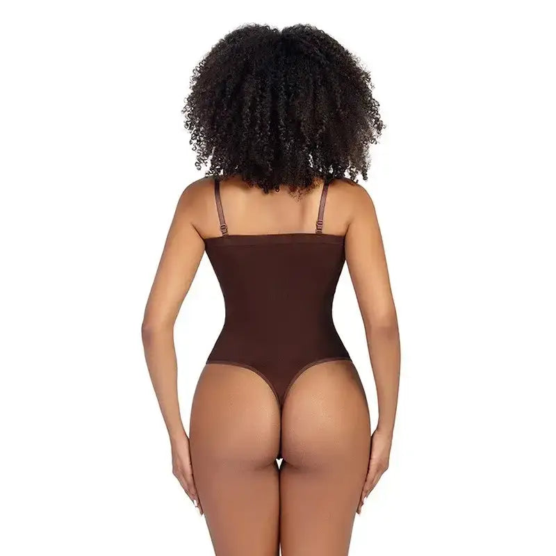 Back view of a woman wearing a brown strapless thong bodysuit for women with adjustable shoulder straps